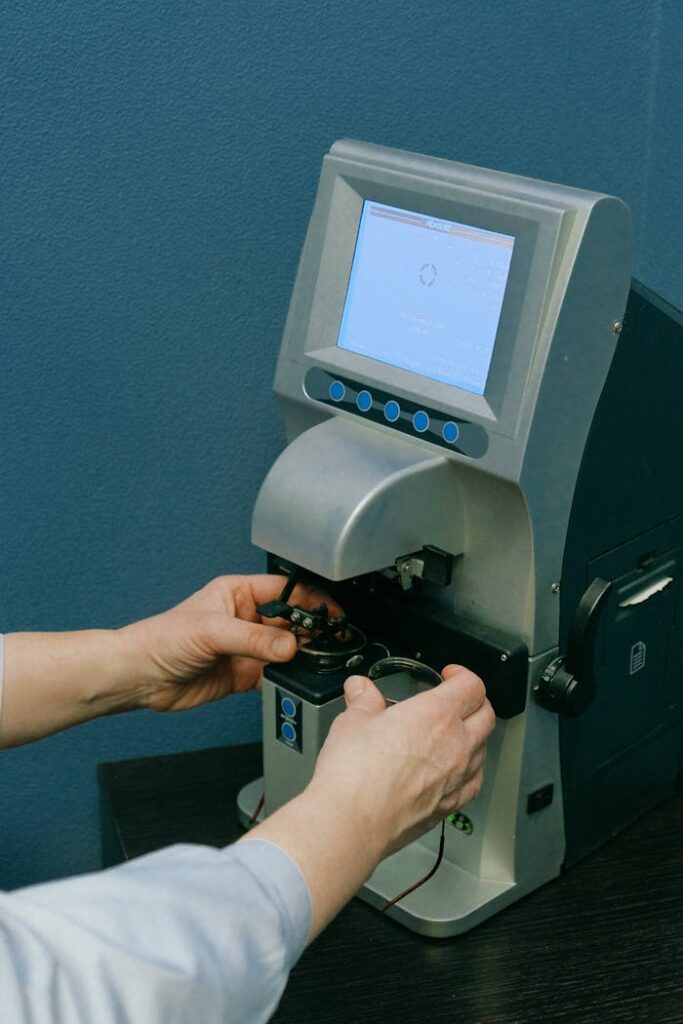 Crafting Captivating Headlines: Your awesome post title goes here Crop anonymous medic in white wear adjusting automatic refkeratometer with small screen and blue buttons while working in doctor office