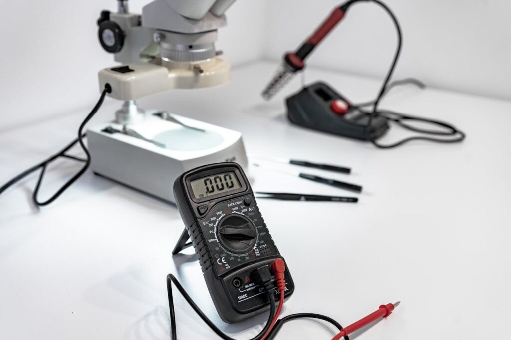 Mastering the First Impression: Your intriguing post title goes here Electronics workbench with multimeter, microscope, and soldering iron.