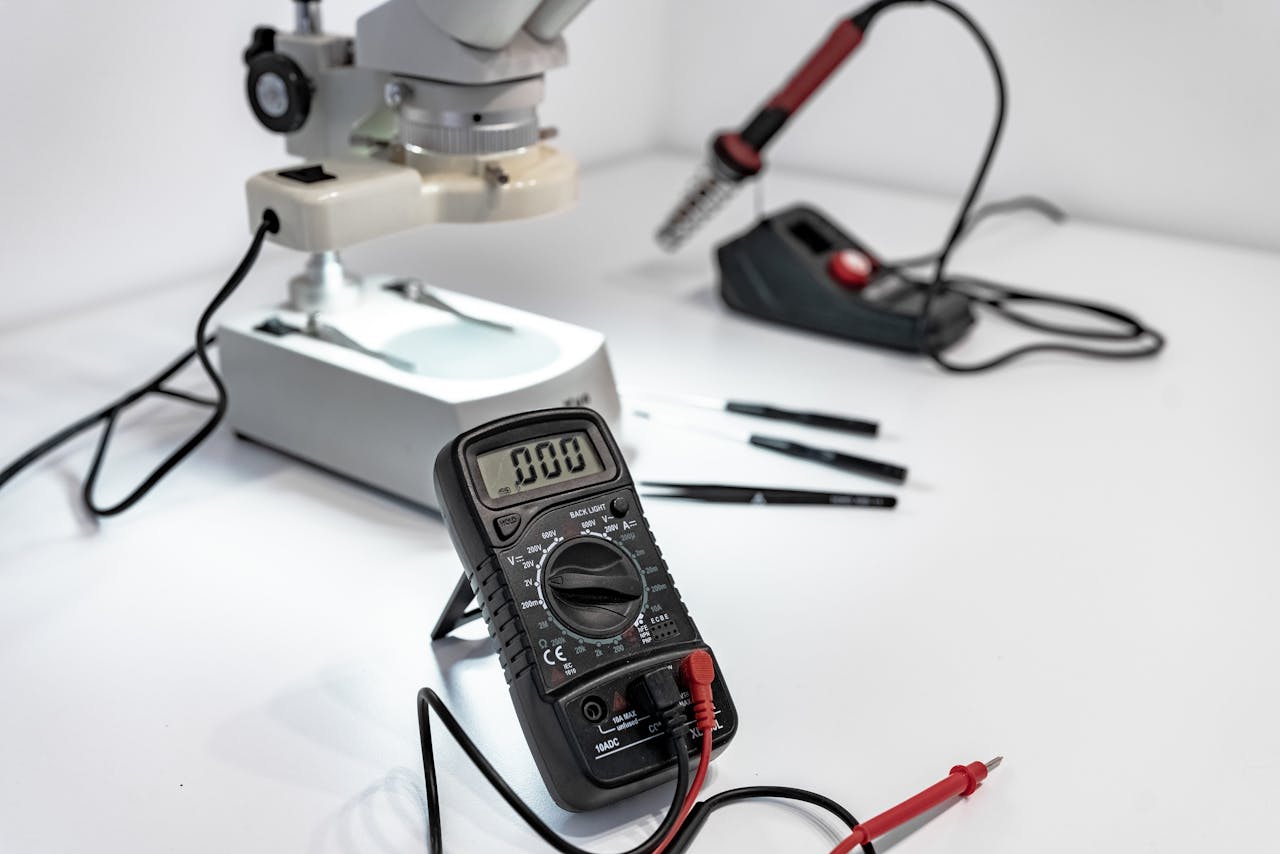 Mastering the First Impression: Your intriguing post title goes here Electronics workbench with multimeter, microscope, and soldering iron.